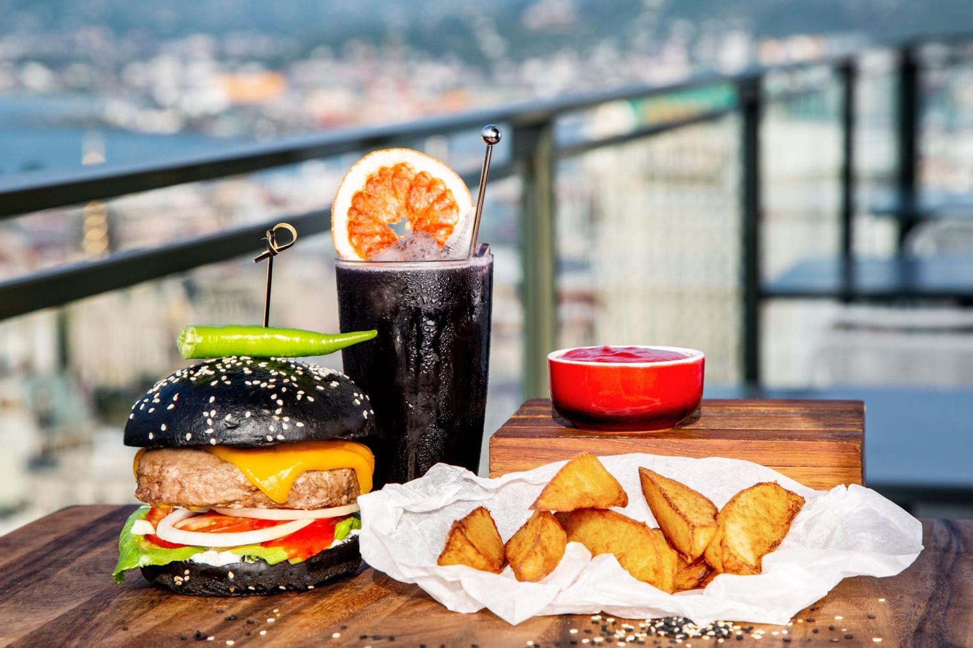 Sheraton Batumi Hotel Exterior photo A black bun hamburger with a cocktail and chicken fingers